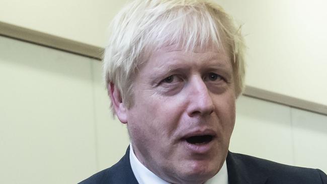 Britain's Prime Minister Boris Johnson gestures during a visit with the police in Wakefield, West Yorkshire, northern England, on September 5, 2019. - UK Prime Minister Boris Johnson called Thursday for an early election after a flurry of parliamentary votes tore up his hardline Brexit strategy and left him without a majority. Johnson was on a campaign footing on September 5 as he launched a national effort to recruit 20,000 police officers in Yorkshire in northern England. (Photo by Danny Lawson / POOL / AFP)