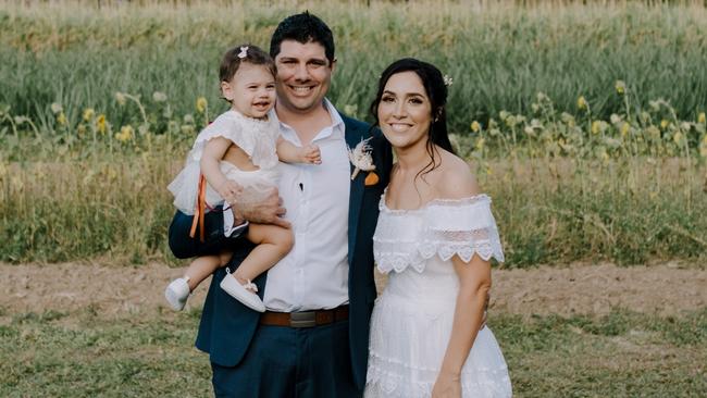 Cairns couple Adam and Tegan Catalano with beloved daughter, Violet Joy, asked for donations for the Queensland Children's Hospital in Brisbane instead of wedding gifts, after the baby underwent emergency open-heart surgery.