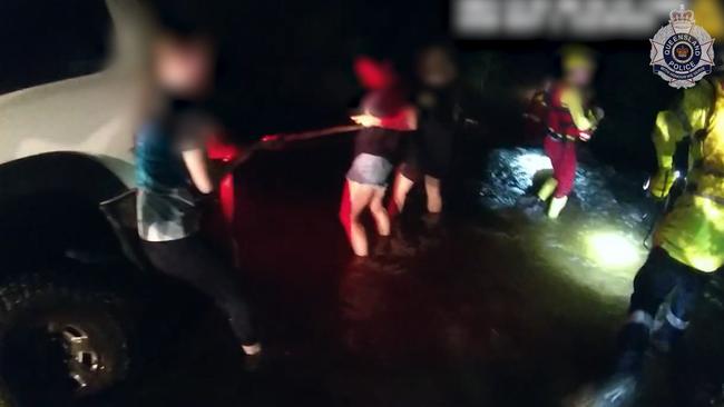 Emergency crews helped to rescue motorists trapped in two cars after they became stuck in floodwaters on Gillies Range Road in Goldsborough on December 7. Picture: Supplied.