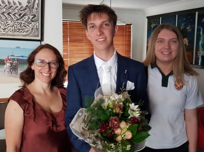 Cameron Duce preparing for his formal after graduating from Merrimac State High School, pictured with mum Sonia and younger sister Tayla.