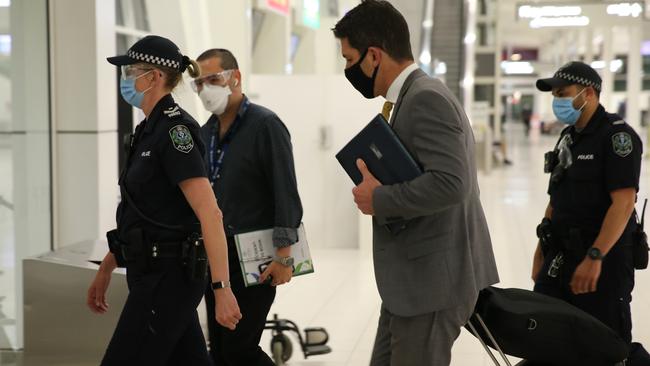 Senator Alex Antic is escorted out of Adelaide Airport by police. Picture: Dean Martin