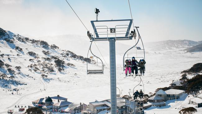 Skiers riding the chair lifts at Charlotte Pass Ski Resort in the Snowy Mountains. Picture: Destination NSW