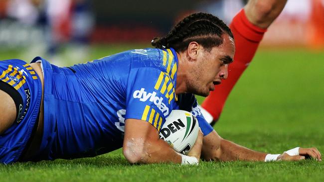 Parramatta's Brad Takairangi scores a try during the Bulldogs v Parramatta rugby league game at ANZ Stadium, Homebush. Pic Brett Costello