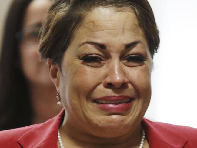 Chelan Lasha weeps as she returns to the courtroom after recess to testify against Bill Cosby during Cosby's sexual assault retrial at the Montgomery County Courthouse in Norristown, Pa., on Wednesday, April 11, 2018. (Dominick Reuter/Pool Photo via AP)