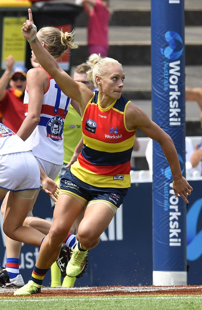 Erin Phillips of the Crows gestures after scoring another goal.