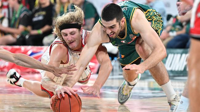 The JackJumpers vice-captain fights for a ball against Daniel Grida and William Hickey of the Hawks during the round three NBL match between Tasmania JackJumpers and Illawarra Hawks at MyState Bank Arena, on October 12, 2023, in Hobart, Australia. (Photo by Steve Bell/Getty Images)