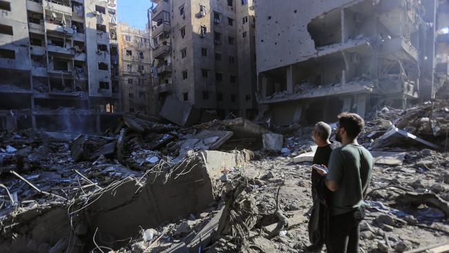 People check the rubble of buildings which were levelled on September 27 by Israeli strikes that targeted and killed Hezbollah leader Hassan Nasrallah. Pictue:AFP