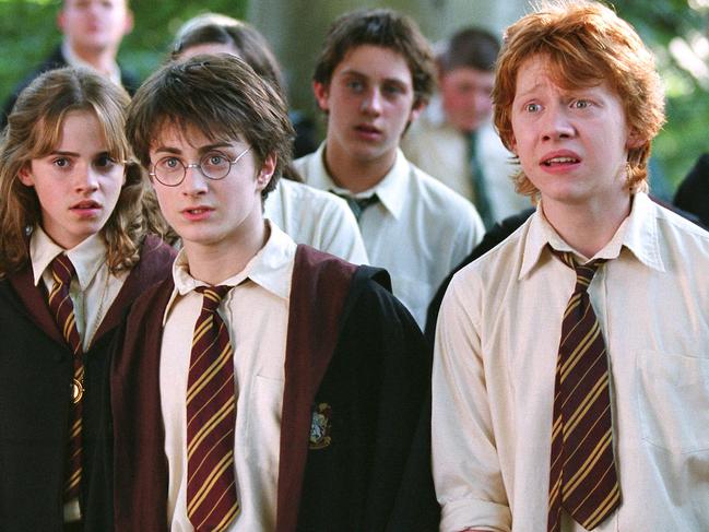 (L-R front) Emma Watson as Hermoine Granger, Daniel Radcliffe as harry potter and Rupert Grint as Ron Weazel in scene from 2004 film Happr Potter and the prisoner of Azkaban. movies actress actor hogwart's students