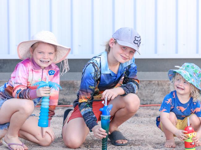 Charlotte, 7, Lucas, 8, and Isaac, 2, Cormack enjoying day one of the Royal Darwin Show. Picture: Glenn Campbell