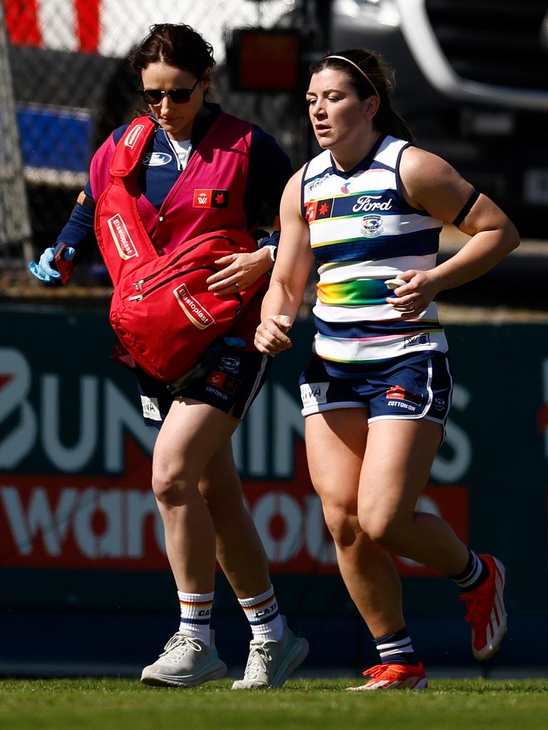 Geelong defender Rachel Kearns leaves the field injured on Saturday. Picture: Michael Willson/AFL Photos via Getty Images