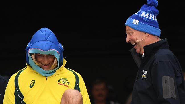 Neale cheers on Adam Gilchrist as he heads down the slide for the Big Freeze/