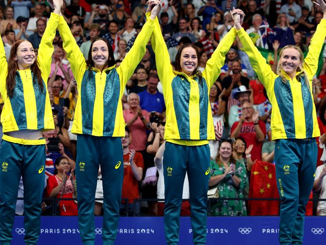 NANTERRE, FRANCE - AUGUST 01: Gold Medalists Mollie OÃ¢â¬â¢Callaghan, Lani Pallister, Brianna Throssell and Ariarne Titmus of Team Australia celebrate on the podium during the Swimming medal ceremony after the Women's 4x200m Freestyle Relay Final on day six of the Olympic Games Paris 2024 at Paris La Defense Arena on August 01, 2024 in Nanterre, France. (Photo by Adam Pretty/Getty Images)