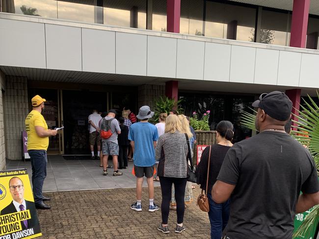 Voters line up at the Mercury House booth in Mackay on the first day of early voting for the 2022 federal election. Picture: Duncan Evans