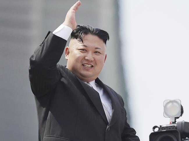 Kim Jong Un waves during a military parade in Pyongyang, North Korea. Picture: Wong Maye-E/AP