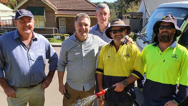 Cr Warren Waddell, Cr Nathan Tilbury, HSC general manager Steven Head (back) with two of the council’s outdoor team watering in Brooklyn. Picture: Supplied