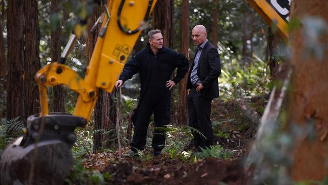 NSW Police Detective Chief Inspector Gary Jubelin (right) chats with one of his detectives as they searched bushland in the Royal National Park south of Sydney, Tuesday, May 30, 2017. Picture: AAP Image/Dean Lewins.