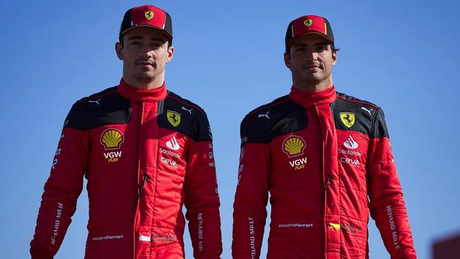 Ferrari drivers Charles Leclerc and Carlos Sainz with the VGW insignia on their suits.