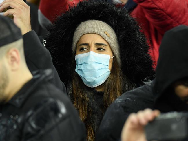 A football fan wearing a mask at the Spanish League football match between Real Madrid and Barcelona at the Santiago Bernabeu stadium in Madrid. Picture: AFP