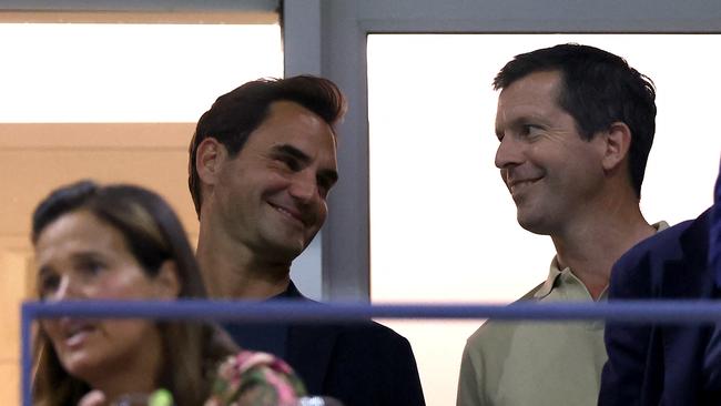 Federer with Tim Henman. Jamie Squire/Getty Images/AFP