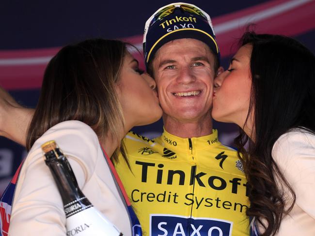 Australian rider Michael Rogers, Tinkoff team, celebrates on the podium after winning the 11th stage of the 97th Giro d'Italia, Tour of Italy, cycling race from Collecchio to Savona on May 21, 2014 in Savona. AFP PHOTO / LUK BENIES