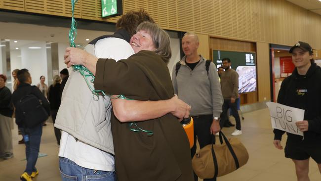 Max Giuliani hugging mum Jo. Tasmanian Olympic bronze medal winning swimmer Max Giuliani arrives back in Hobart after the Paris games. Picture: Nikki Davis-Jones