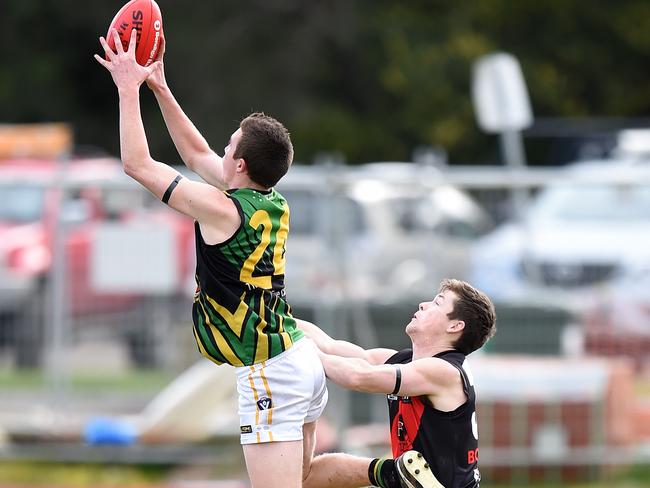 Dromana's Billy Quigley takes a high mark.