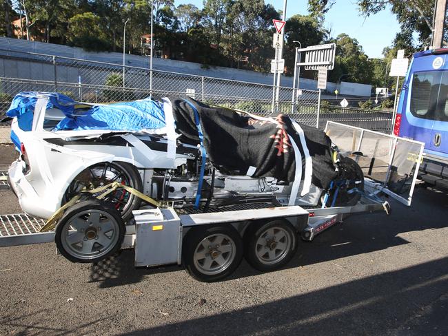 The racing team at Artamon will check over the wreckage. Picture: Bob Barker.