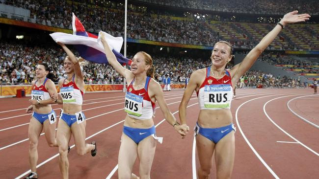 Russia's Yuliya Chermoshanskaya, right, Yulia Gushchina, second left, Evgeniya Polyakova, left, and Aleksandra Fedoriva, second right, celebrate winning the gold in the women's 4x100-meter relay final at the Beijing 2008 Olympics.