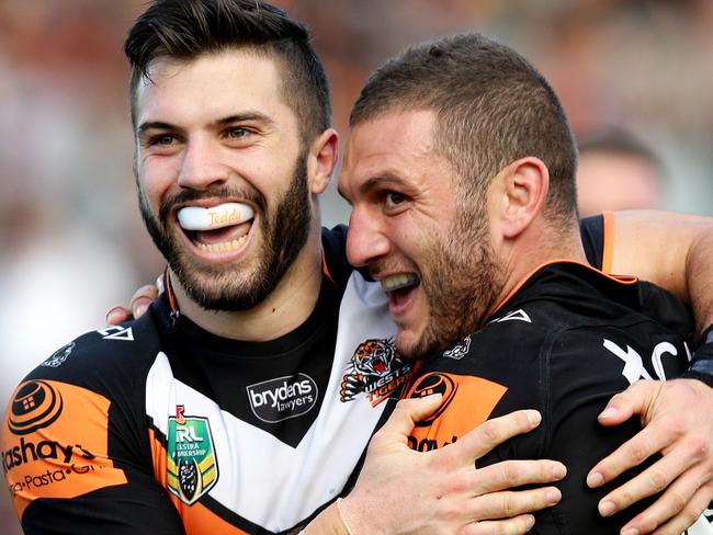 Tigers James Tedesco and Robbie Farah celebrate Tigers Martin Taupau scoring a try during the NRL game between the Wests Tigers and the New Zealand Warriors at Campbelltown Stadium , Campbelltown.Picture Gregg Porteous