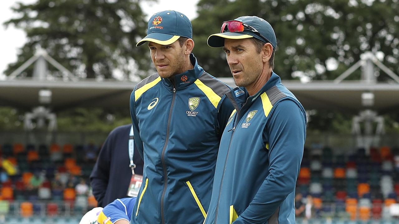 Tim Paine and Justin Langer inspect the pitch.