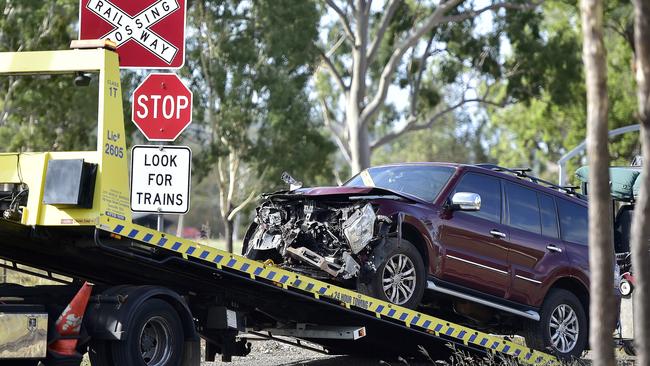 A four-wheel-drive towing a trailer had its front end smashed after it collided with a freight train pulling 28 carriages near Alligator Creek Road. PICTURE: MATT TAYLOR.