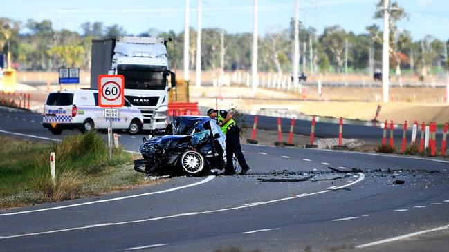 Emergency services attend a fatal car crash on the Bruce Highway, south of Townsville at Mount Surround. Picture: Alix Sweeney