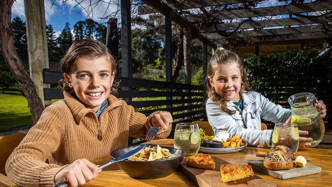 Harper, 9, and Maya Greer, 7, taste the ‘kid’s degustation’ at The Currant Shed. Picture: Tom Huntley