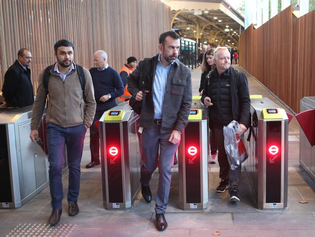 Commuters exit the new entrance. Picture: David Crosling