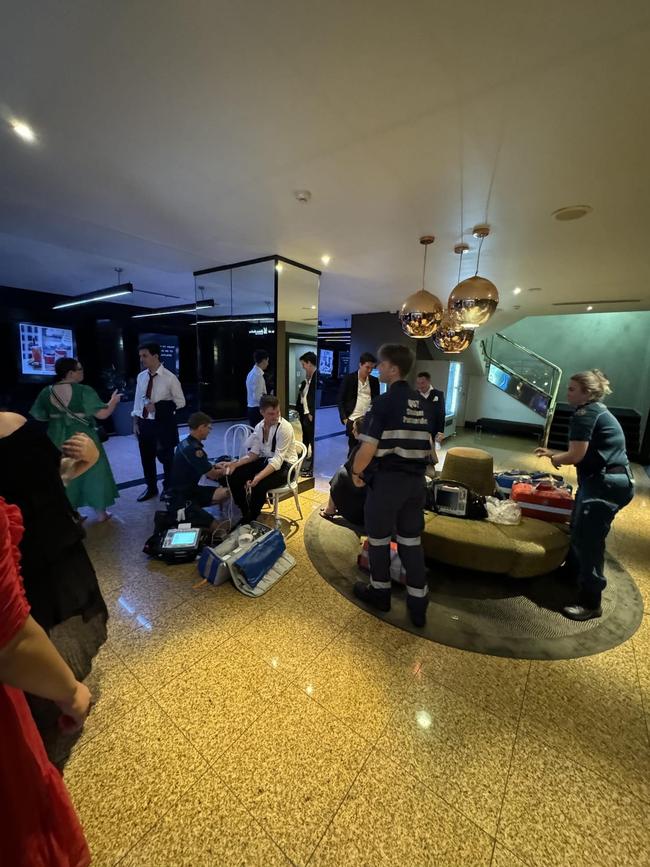 Party-goers from the Young Liberal federal convention are checked by paramedics after being caught in the lift. Picture: Instagram.