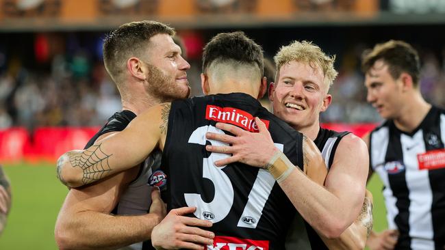 Collingwood players swarm Markov after his goal against the Suns on Saturday night. Picture: Russell Freeman/AFL Photos