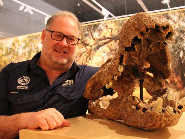 Megafauna Central senior curator of earth sciences Adam Yates next to a croc fossil at Alice Springs Megafauna Central, August 2024. Picture: Gera Kazakov.