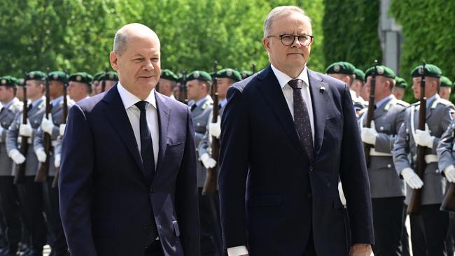 German Chancellor Olaf Scholz and Anthony Albanese review a military honour guard at the Chancellery in Berlin on Monday. Picture: AFP