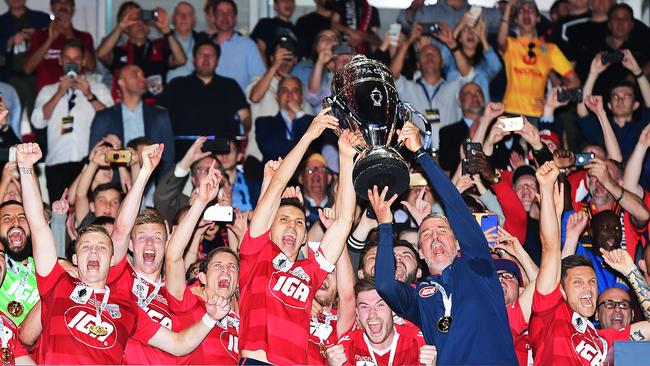 Adelaide United’s ex skipper Isaias and ex coach Marco Kurz celebrate winning the 2018 FFA Cup at Coopers Stadium. (Photo by Mark Brake/Getty Images)