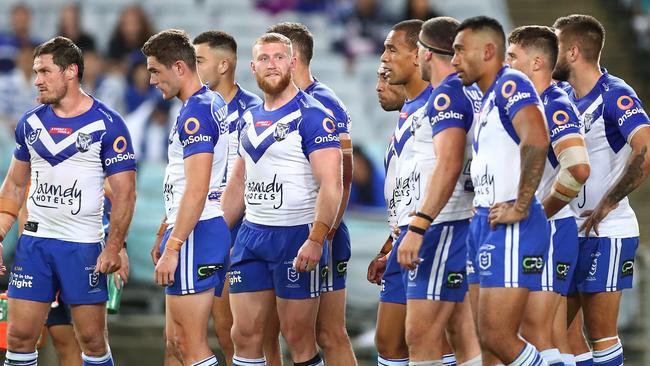 SYDNEY, AUSTRALIA - APRIL 10: Bulldogs players look dejected after conceding a try during the round five NRL match between the Canterbury Bulldogs and the Melbourne Storm at Stadium Australia, on April 10, 2021, in Sydney, Australia. (Photo by Mark Metcalfe/Getty Images)