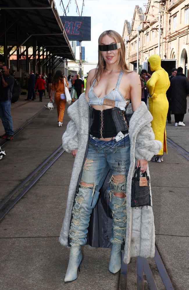 Another look from that year featured incredibly distressed jeans and a waist trainer. Picture: Matrix