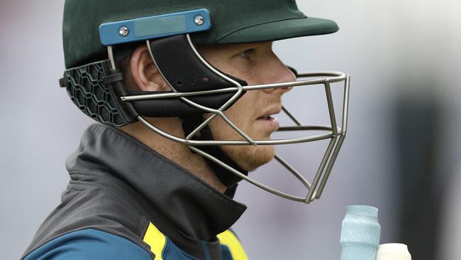 Steve Smith of Australia wears a helmet with stem guards following his concussion injury.