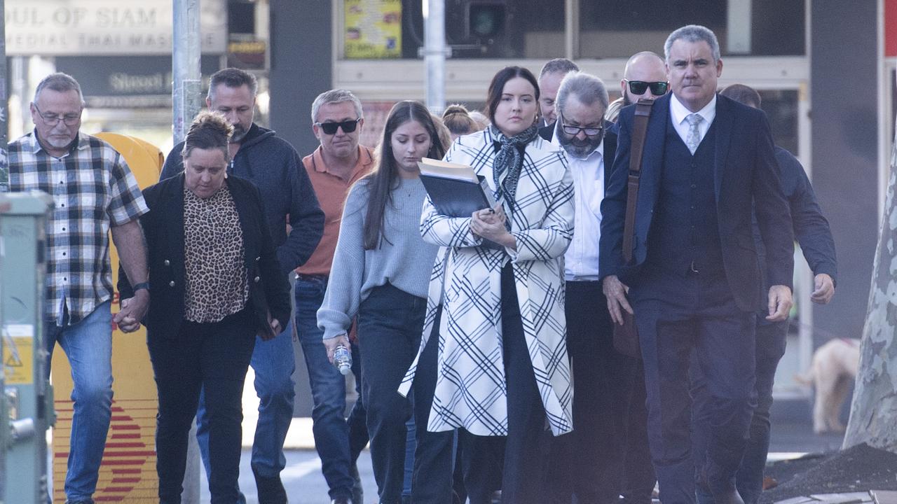 Button (second from right) arrived at Newcastle court encircled by family and friends. Picture: NCA NewsWire / Jeremy Piper