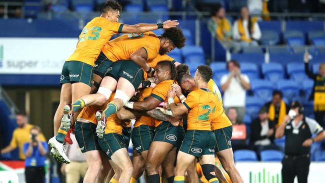 The Wallabies celebrate after Quade Cooper’s clutch finish. Picture: Getty Images