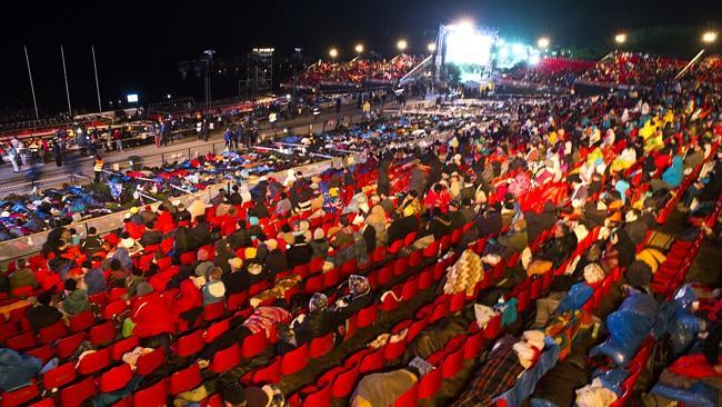 Sombre occasion ... Australians and New Zealander attend the Anzac Day dawn service at An