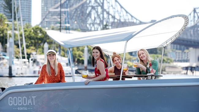 Lucy Bain, Ell on the Brisbane River in a GoBoat, which has had to move to Breakfast Creek. Picture: Tara Croser