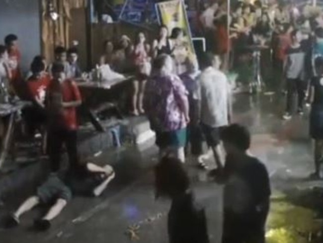 First the son, bottom left, cops a punch to the head. Picture: CCTV Image