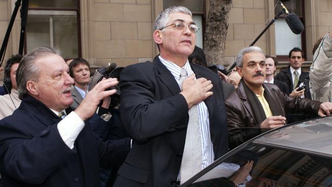 Mick Gatto puts his hand on his heart to thank his supporters outside the Supreme Court after he was acquitted of murdering Veniamin.