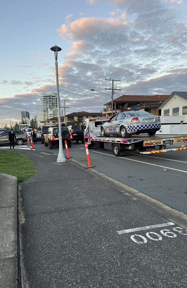 Cars used in the production of the Hollywood movie, Runner, were towed onto Marine Pde at Labrador for filming. Picture: Facebook/Matthew Garfield.