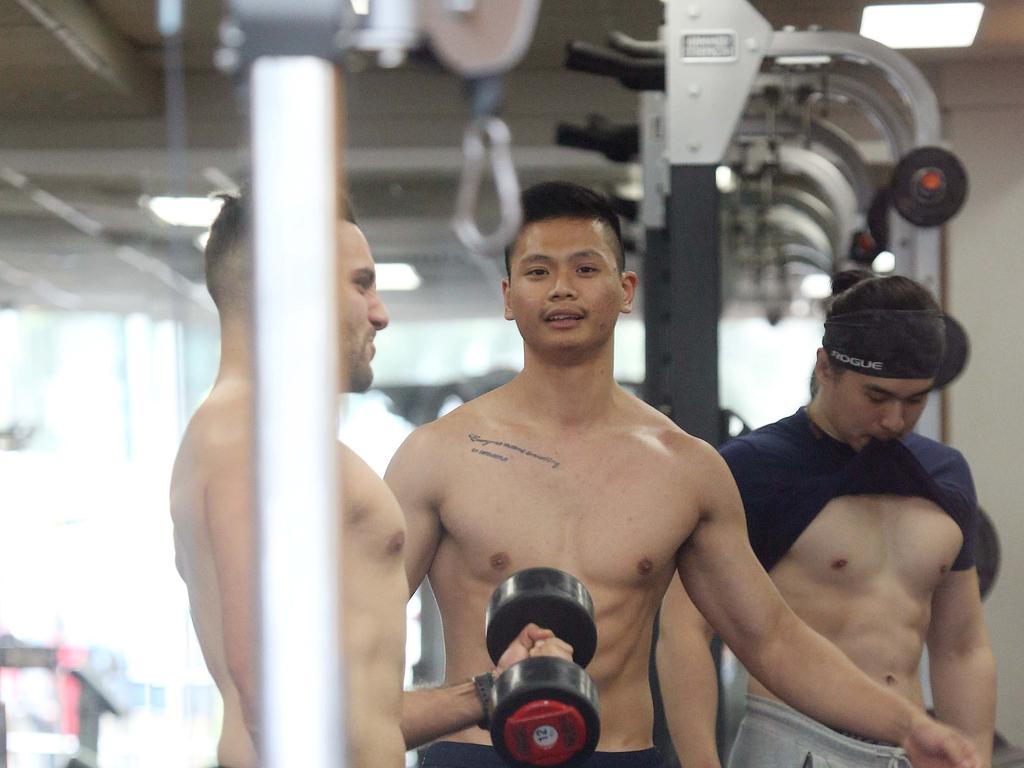 Gym junkies get their last workout at the Anytime Fitness at Burwood just after the cut-off time on Monday, March 23. Picture: MatrixPictures